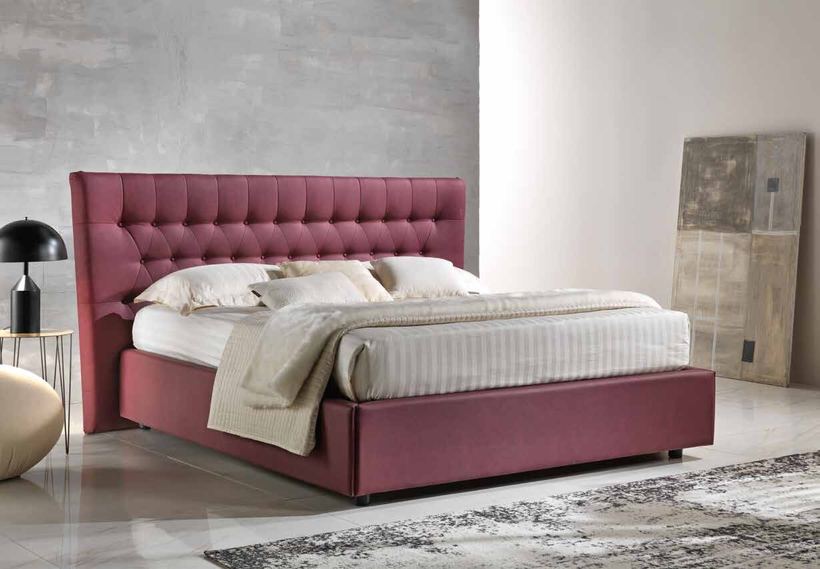 Juno bed with a tall buttoned headboard in deep red