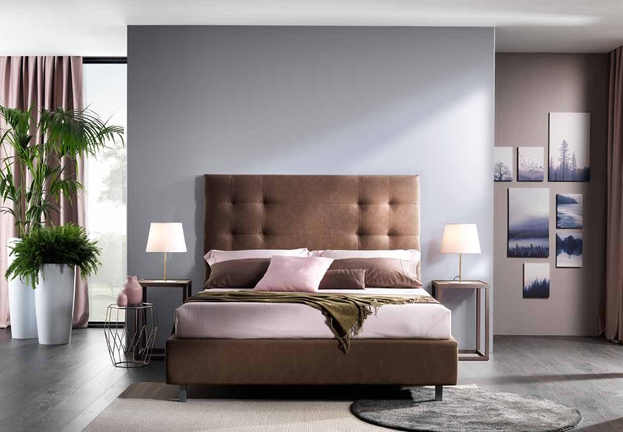 Titan bed with a very tall buttoned headboard in brown