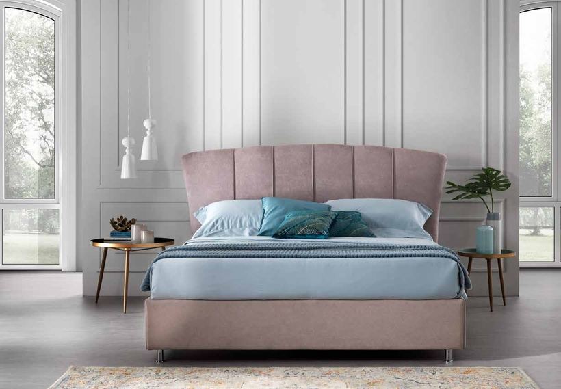 Comet bed with a fan-shaped channel-stitched headboard in blush