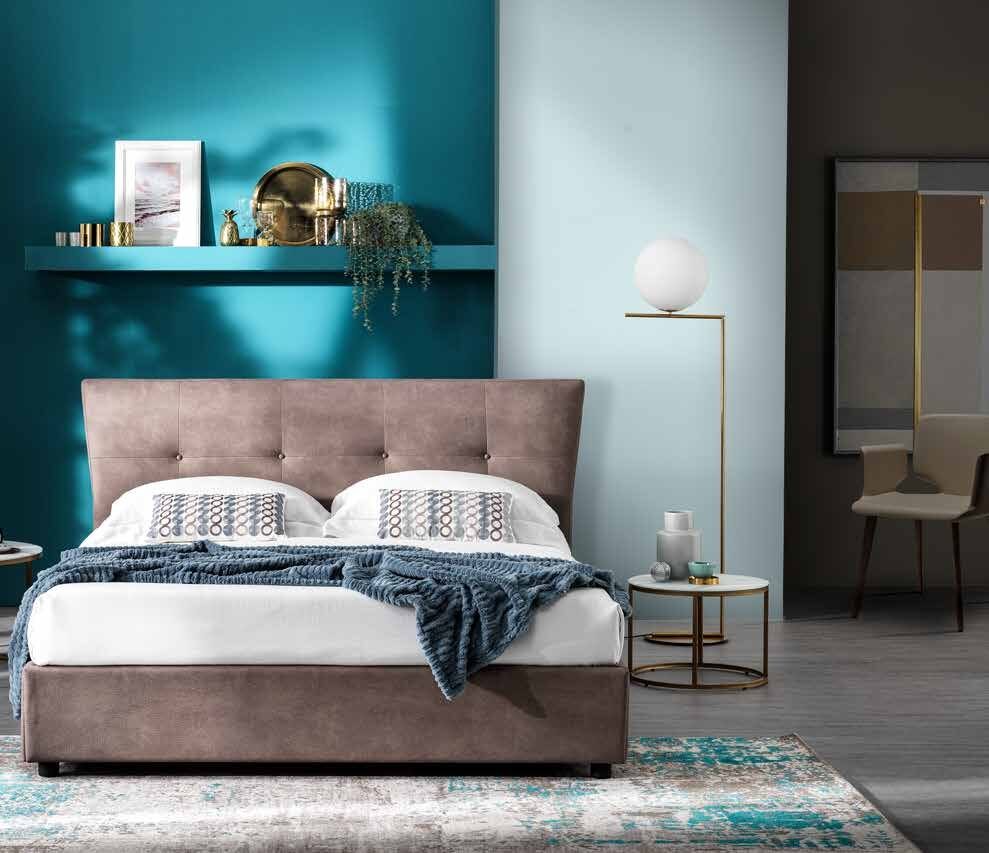 Orbit bed with a buttoned headboard and flared sides in taupe