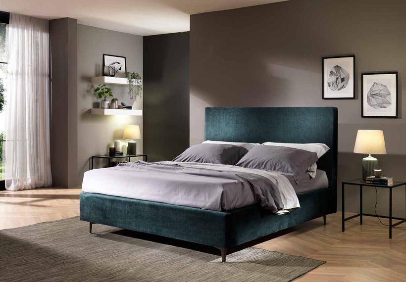 Swan bed with a plain panel headboard in teal velvet