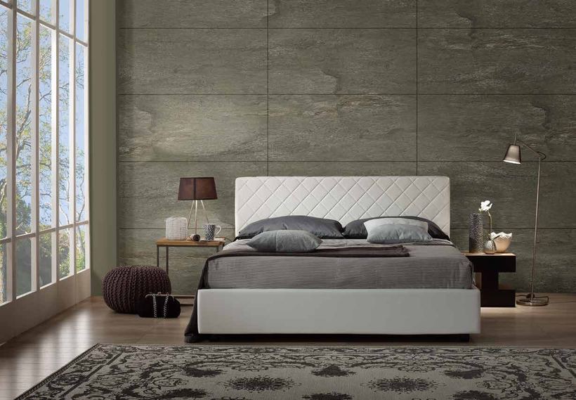 Hare bed with a diamond-quilted white headboard
