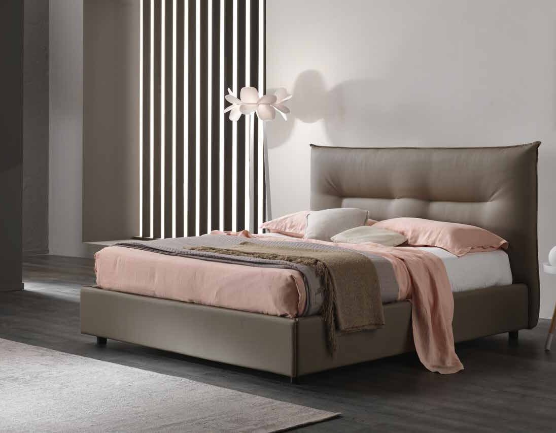 Vega upholstered bed with a soft padded headboard in a bedroom