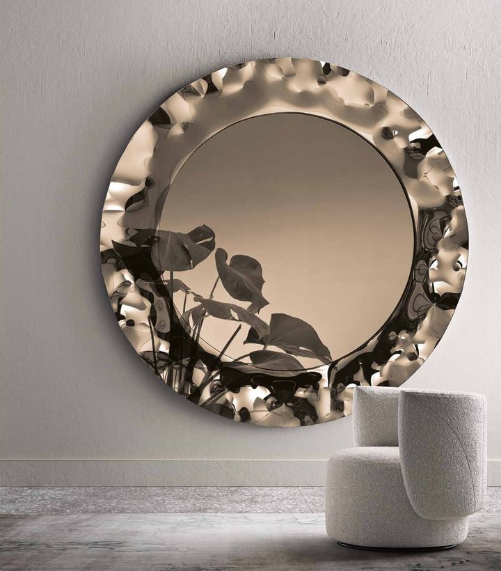 Garda round mirror in bronze with a rippled glass frame