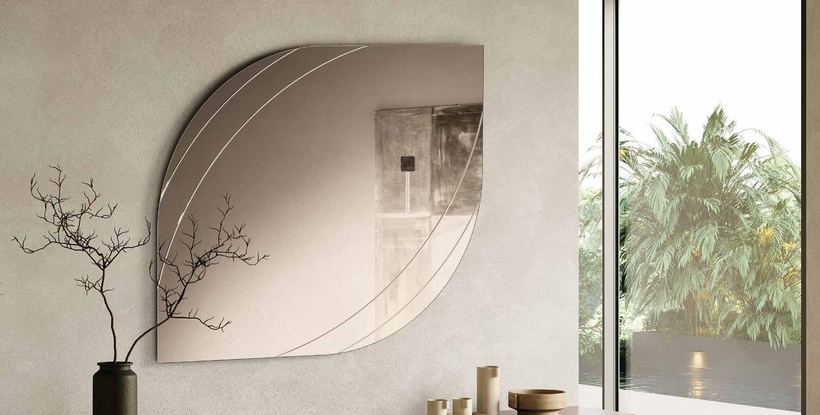 Iseo bronze mirror with curved grooves above a low unit