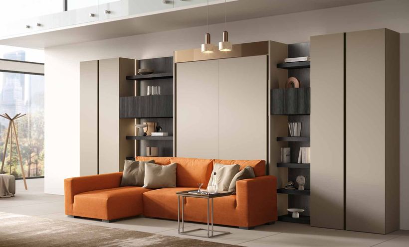 Duvet wall bed closed: a wall of wardrobes with a sofa in front