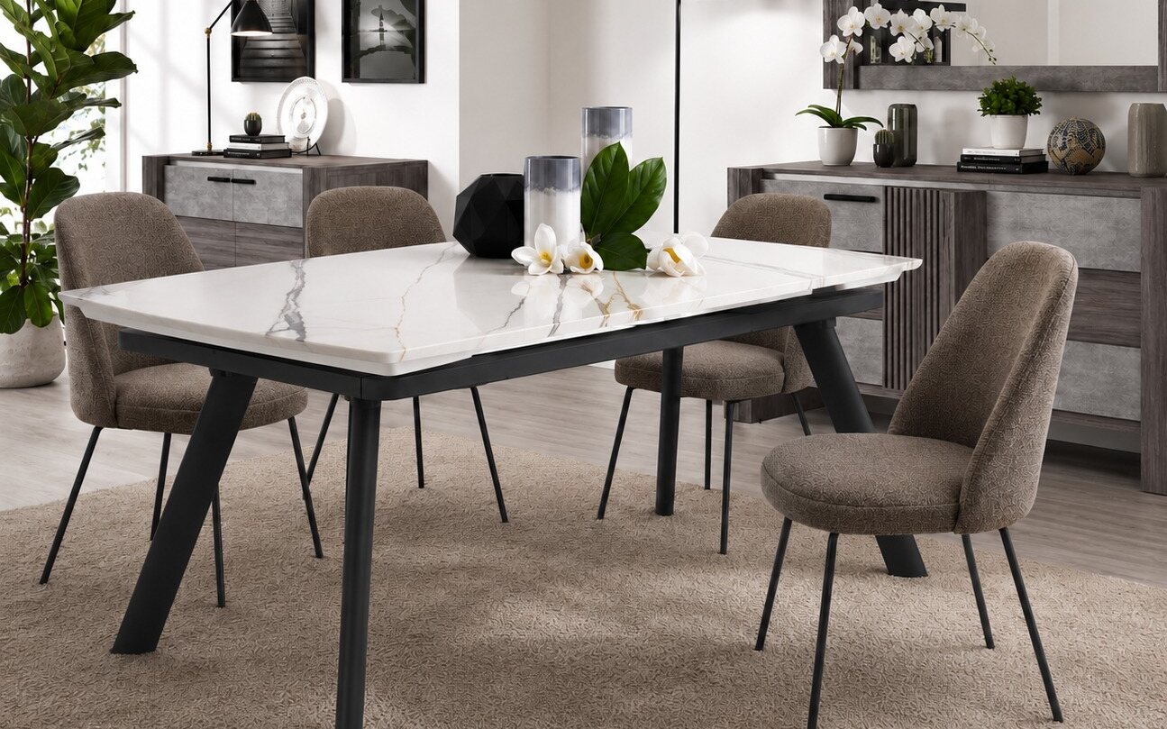 White ceramic table top with gold and grey veining on a black splayed-leg base