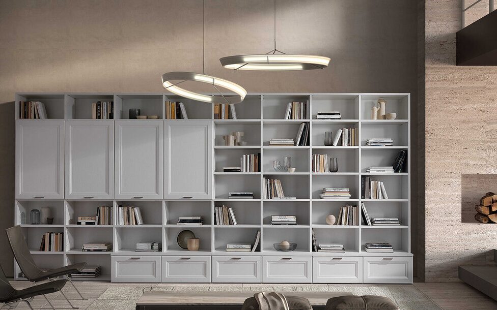 Full-height bookcase wall beside a fireplace