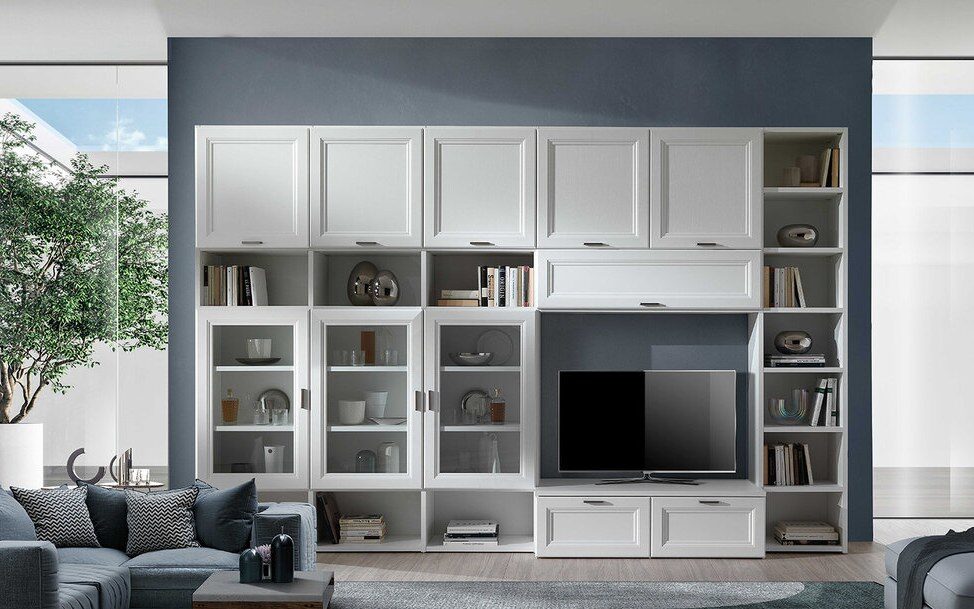 Glass-fronted display cabinets flanking a television