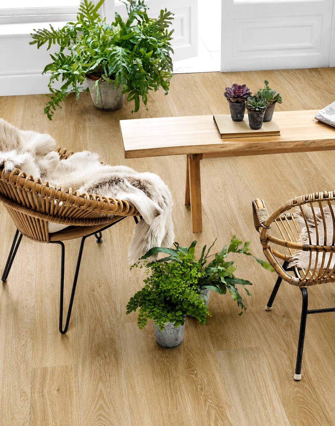 Wood-effect plank tiles with rattan chairs and plants